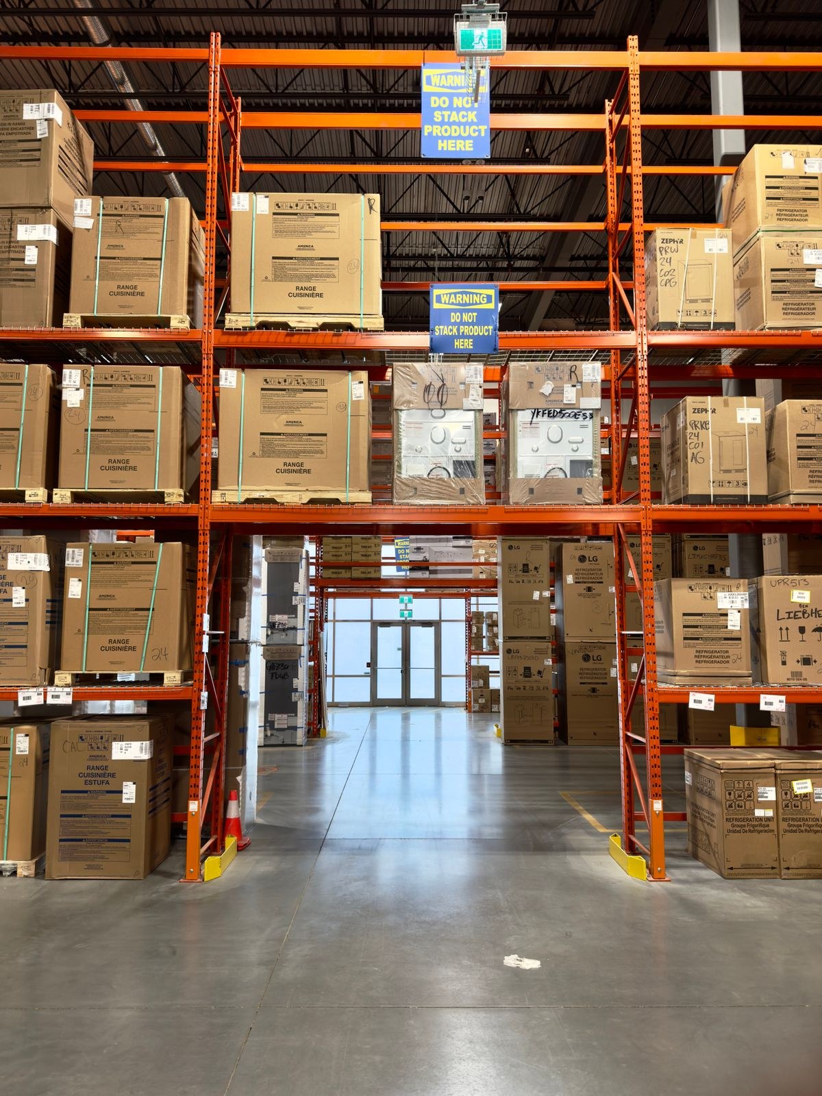 Tall warehouse racks stocked with cardboard cartons